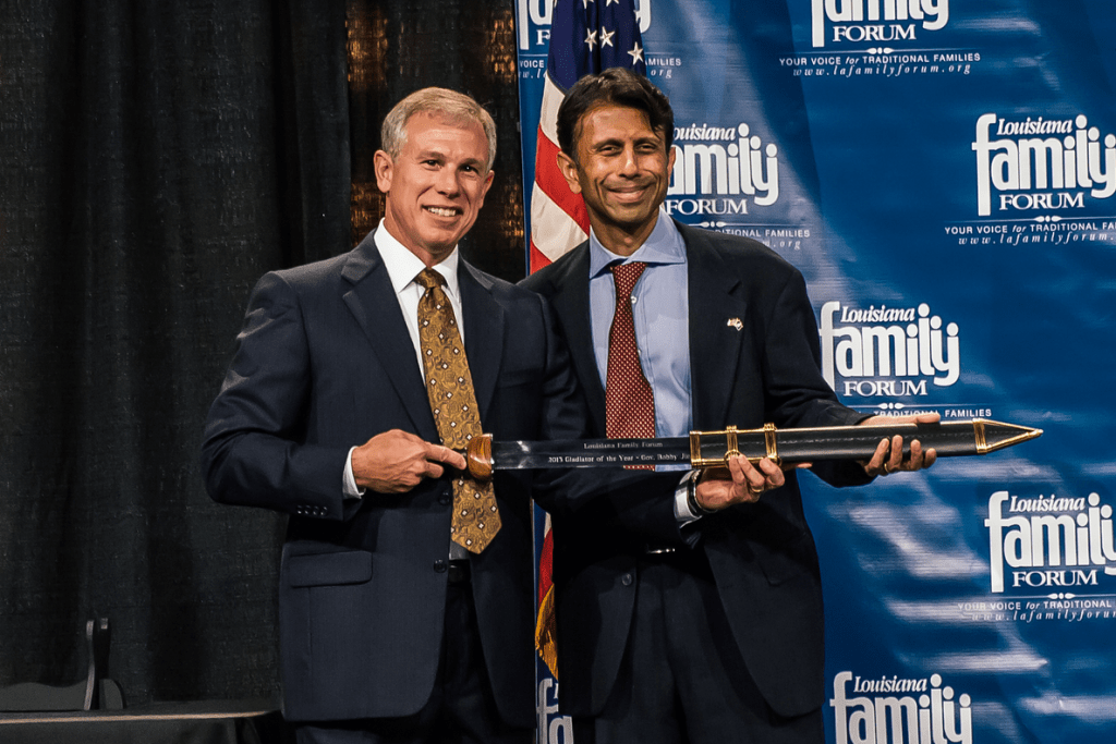 Bobby Jindal holding Gene Mills's "Gladiator" sword during last week's Louisiana Family Forum banquet